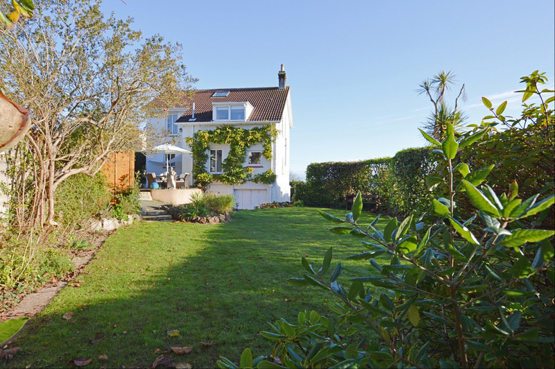 A beautifully presented Detached House set within sunny; private; enclosed gardens and enjoying views over the surrounding tree-lined neighbourhood and out towards the sea and Torquay Marina.
